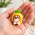 Nanci Fruit pineapple figure held in a hand, showing one possible blind box design. Random figure included; pineapple not guaranteed.